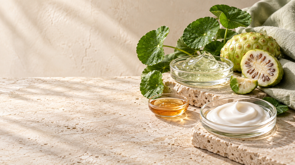Celimax-inspired Korean skincare editorial still life with noni fruit, cica leaves, serum and cream