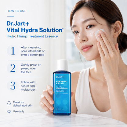 A woman applies a skincare treatment essence to her face while holding a blue bottle of Dr. Jart+ Vital Hydra Solution.