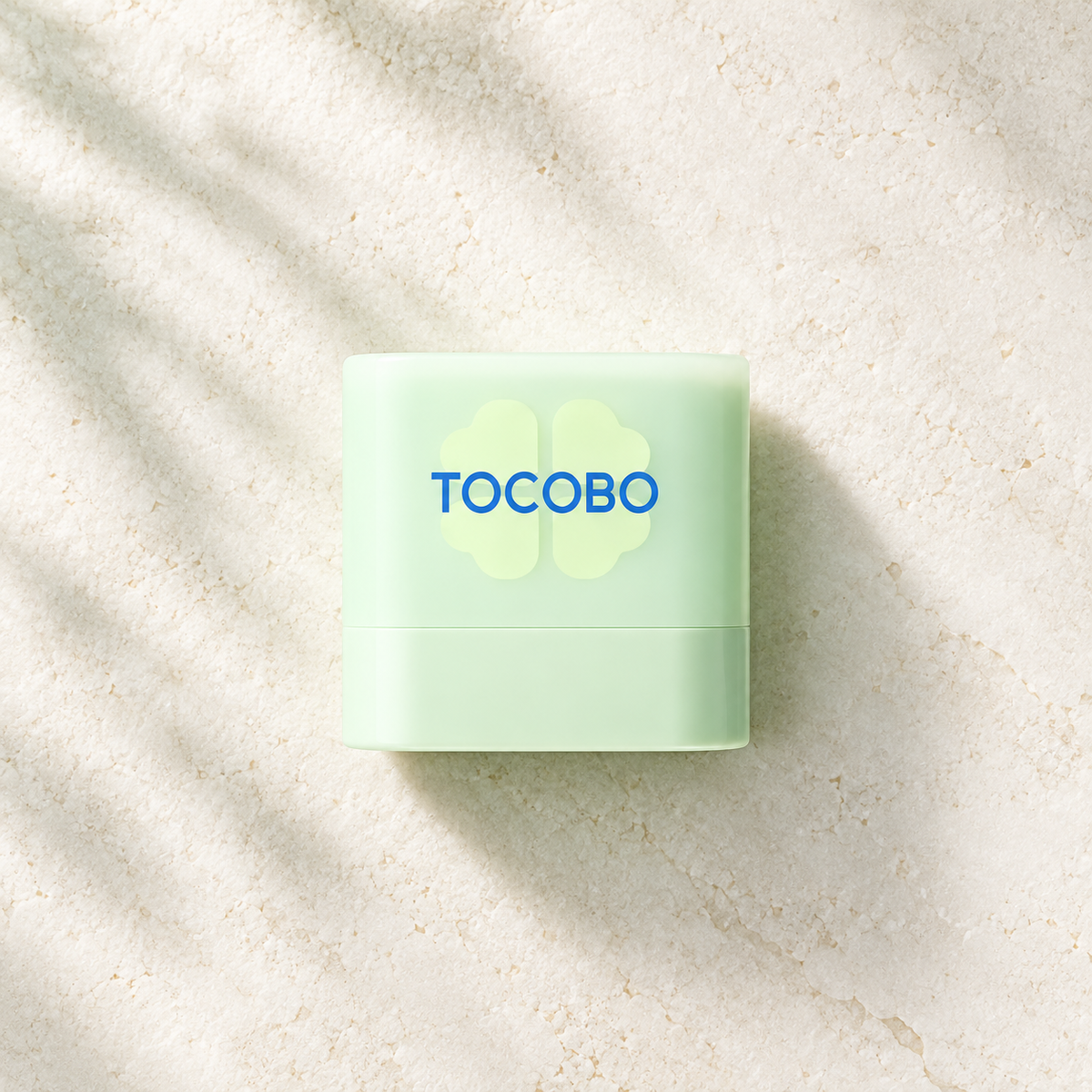 TOCOBO Cica Cooling Sun Stick Mini 10g SPF50+ PA++++ product flat lay on an ivory surface