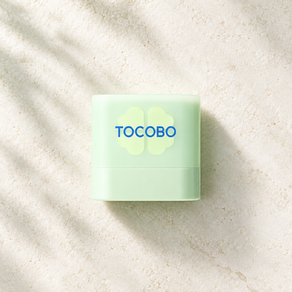 TOCOBO Cica Cooling Sun Stick Mini 10g SPF50+ PA++++ product flat lay on an ivory surface