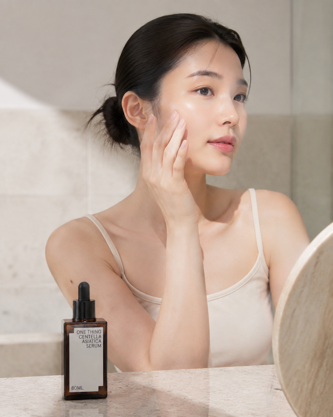 One Thing Centella Asiatica Serum 80ml lifestyle image of person applying serum